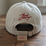 BadCherry Embroidered Logo Cap – Adjustable Cream White Cotton Baseball Hat | Minimal Streetwear Unisex